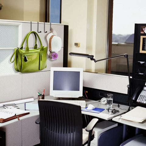 Four Pack Cubicle Coat Hooks For 2 Inch Wide Panels, Double Arm Metal Hangers holding a purse on cubicle wall