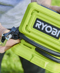 Close-up of hands holding 18V One Plus Cordless Tire And Ball Inflator With Mini Compressor 11 Bar Max Fast Inflation To 32 PSI In Under A Minute