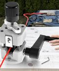 Hella Tough Manual Drill Powered Wire Stripper Machine For Copper Cable Recycling portable device stripping red wire on wood surface.