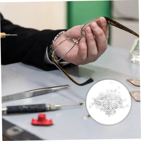 Person repairing eyeglasses with Rimless Glasses Washers And Metal Flat Gaskets Eyeglass Repair Kit 200 Pcs Fasteners