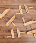 8 Inch Wooden Handscrew Clamp Set For Woodworking Heavy Duty Hand Screw Clamps Acme Thread Technology Quick Secure Grip Stainless Spindle Durable Construction Great For Finishing Work 2 Pack, two wooden clamps on wood surface