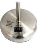 Close-up of brushed steel lamp base with built-in charging outlet, part of Brushed Steel Desk Lamp With Built In Charging Outlet And Drum Fabric Shade, Slim Modern Table Light In Gray For Home Or Office, Plug In Convenience And Clean Sleek Look.