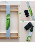 Wooden Weaving Loom Kit For Kids And Adults Large Frame Tapestry Loom 9.85 By 15.5 Inches with woven camera wrist strap on loom.