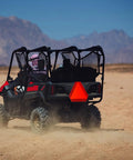UTV with Two Pack Slow Moving Vehicle Signs With Mounting Brackets For Golf Carts Tractors And UTVs 14 By 16 Inch Diamond Grade Reflective 80 Mil Outdoor Safety Signs No Hassle Hardware Included For Quick Install in desert terrain.