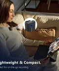 Woman using 2-Person Wireless Lavalier Microphone System For iPhone, Cam, And Android with 40 Hour Battery Life while on tablet