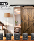 Interior Box Rail Sliding Door Hardware Kit for Wood Doors, wall-mounted aluminum alloy track, black finish, installed view.