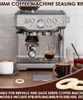 Espresso machine on a countertop with 54mm silicone steam ring gaskets suitable for Breville and Sage models, preventing leaks.