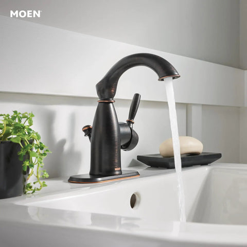 Mediterranean Bronze Rustic Farmhouse Bathroom Faucet With One Handle For Single Hole Install And Optional Deck Plate Easy Temperature And Water Control For That Classic Farmhouse Vibe, installed on a white sink with running water