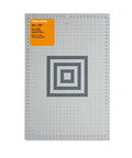 Fiskars cutting mat, front view; 24 x 36-inch two-sided self-healing mat with grid for quilting and crafts