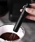 Dope Pink Magnetic Telescopic Coffee Distribution Needle And Rock Solid Stainless Steel Espresso Grounds Leveler For Zero Clumping And Effortless Daily Grind Vibes in use over ground coffee