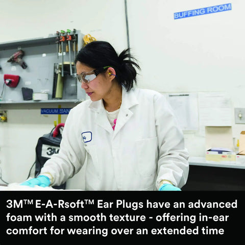 Person in lab coat with Neon Yellow E A Rsoft Foam Ear Plugs 200 Pairs Box NRR 33 for drilling, grinding environments