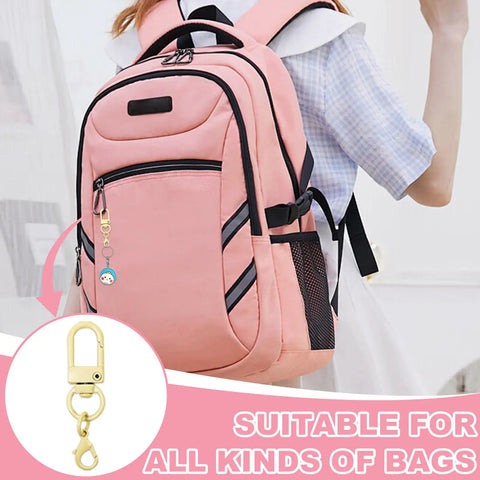 Top Notch Double Head Lobster Claw Clasps Featuring Smooth Swivel Snap Hooks And Sweet Multi Color Collections attached to pink backpack.