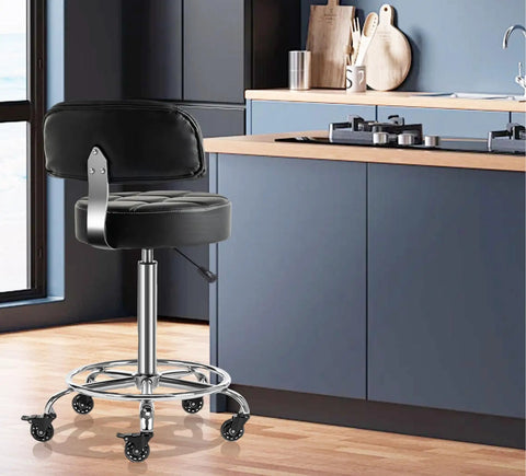 Lockable Boss Ergonomic Rolling Stool With Backrest And Foot Rest, hydraulic height adjustable, in kitchen setting, black