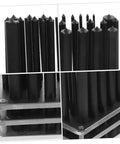 Close-up of Ergonomic Transfer Punch Set 28 Pieces For Mechanics with black punches on stacked steel plates.