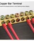 Top Shelf One Pack Golden Wire Screw Connector Terminal Block With Snug Six By Nine Crimp Holes For Heavy Duty Electrical Wiring And No Fuss Quick Connect Installations showing golden copper bar with red wire connectors.