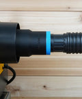 Top Shelf Dust Collection Hose Adapter Fits DW735 Series Planers attached to vacuum hose, designed for clean woodworking jobs.