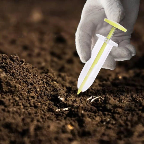Go To Seed Spreader And Sowing Tool For Gardeners with ergonomic design, shown in hand sowing seeds into soil in outdoor setting.