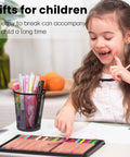 Child drawing on desk with Black Mesh Pencil Holder Metal Pen Cup Desk Organizer Set Of 6, filled with pens and markers.