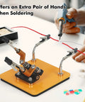 Magnetic Helping Hands Soldering Station with stable base and four handy flexible arms holding wire during electronics repair.