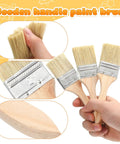 Hand holding 30 Piece Flat Paint Brush Set With Thick 12mm Wood Handles 2 Inch Oil Based Stain Brushes For Interior And Exterior Walls