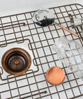 Low Profile Kitchen Sink Basket Strainer Drain in Antique Copper in sink with barware accessories