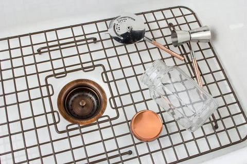 Low Profile Kitchen Sink Basket Strainer Drain in Antique Copper in sink with barware accessories