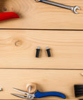 Spring Loaded Cabinet Door Repair Pins Kit For Cabinet Door Hardware Easy No Fuss Install Plastic And Metal Pins With Damper Function For Smooth Precise Fit On Furniture, two black pins on wood