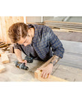 Man using Compact 1/2 Inch 20V Cordless Drill Driver Featuring Brushless Motor And Adjustable Torque Settings on wood.