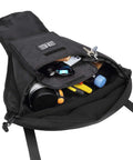Rugged Storage Bag For UTV Cab Center Seat With Felt Lined Pockets And Key Lanyard, displaying open pockets and accessories inside.