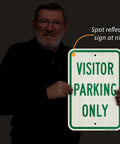 Man holding Built Tough Visitor Parking Only Sign 18x12 inch reflective green and white sign for driveways.