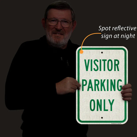 Man holding Built Tough Visitor Parking Only Sign 18x12 inch reflective green and white sign for driveways.