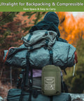 Backpacker carrying Ultralight Hammock Underquilt For Camping Full Length Warm Three To Four Seasons on forest trail
