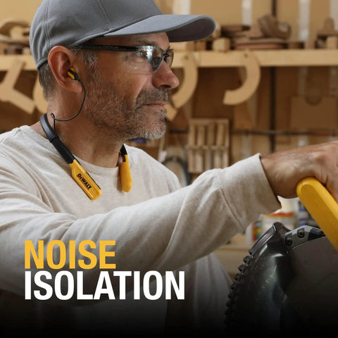 Man wearing heavy duty Bluetooth neckband headphones for jobsite use with 30 hour runtime and noise isolation, working in workshop.