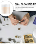 Ten Piece Pro Grade Watch Dial Cleaning Pens With Wooden Handles For Ultra Precise Movement Cleaning And Delicate Part Care Portable Watch Maintenance Tools For Repair Pros And Hobbyists. Person using cleaning pen on watch components on workspace.