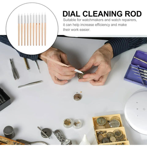 Ten Piece Pro Grade Watch Dial Cleaning Pens With Wooden Handles For Ultra Precise Movement Cleaning And Delicate Part Care Portable Watch Maintenance Tools For Repair Pros And Hobbyists. Person using cleaning pen on watch components on workspace.