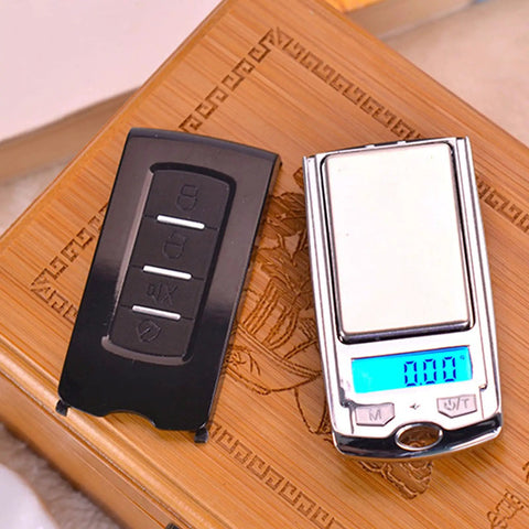 Pocket Scale Two Piece Set with 200g Capacity and 0.01g Readability on wooden surface with LCD display