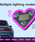 Heart Shaped Car LED Ambient Light With Solar Rechargeable Power, showing pink heart light on car with suction cups