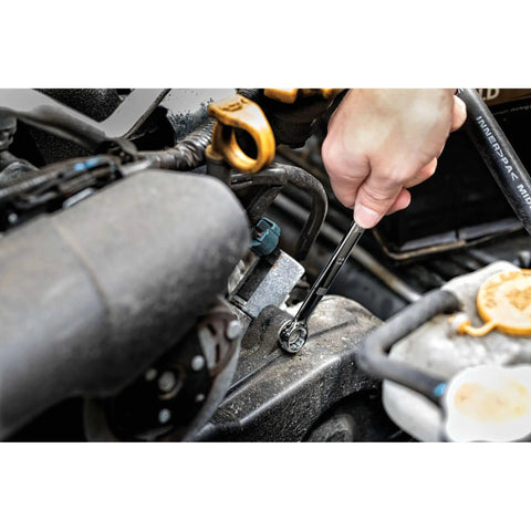 Mechanic using Beast Pro Mechanics Tool Set with quarter inch drive, tightening bolt with 72-tooth ratchet in engine bay.