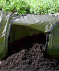 Roll Mix Compost Bin Tumbler for Home Garden Green 41 Gallon Capacity 26 Inches Wide shown dispensing compost on soil