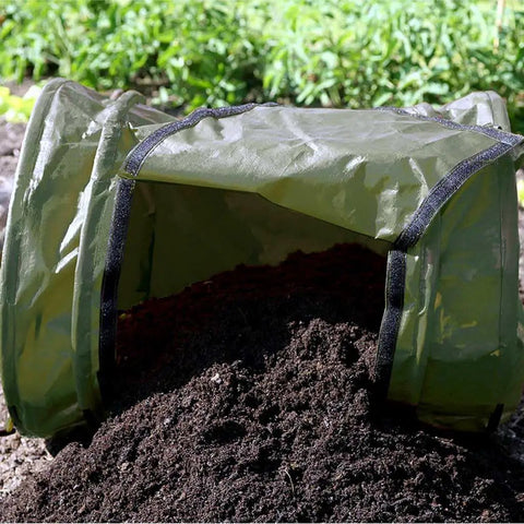 Roll Mix Compost Bin Tumbler for Home Garden Green 41 Gallon Capacity 26 Inches Wide shown dispensing compost on soil