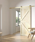 Gold Barn Door Hardware Kit For Sliding Doors, Modern Brushed Brass Finish, 6 Ft 7 In Track, installed in a bright room