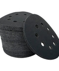 Kickstart Your Woodworking Projects With These Badass 5 Inch Silicon Carbide Sanding Discs featuring 8 quick hook loop holes stacked for easy access.