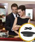 Couple admiring jewelry with Smooth Rotating Jewelry Display Stand With Adjustable Speed Motorized Turntable For Retail Store Showcase And Product Photography Features Black Base And Convenient Usb Connectivity For Easy Power On Anywhere.