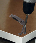 Installing iron lid support hinges for chest lids and wood boxes with a drill, showing the spring loaded curved arm design