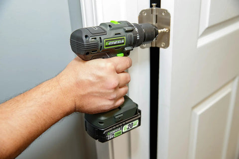 Person using Beefy 20V Cordless Drill With One Half Inch Metal Ratcheting Chuck 450 Inch Pounds Of Torque Two Speed Gear Box on a door hinge.