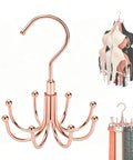 Rotating Rose Gold Closet Hangers For Bras Tanks Belt Ties 360 Degree Swivel Hook Multi Purpose Wardrobe Storage System visible with bras and belts.
