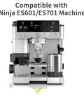 Front view of a stainless steel Ninja espresso machine with portafilter, cup under the brew spout, and milk frother.