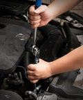 User using Offset Extension Wrench Kit With Half Inch, Quarter Inch And Three Eighth Inch Square Drive Adapters in engine bay.