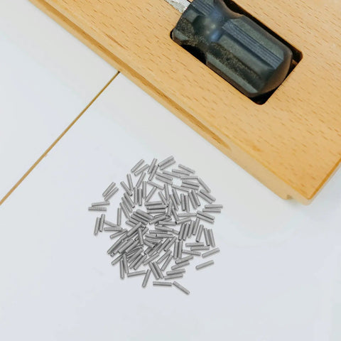 100 Pieces Carbon Steel M2.5x10 Hex Socket Headless Grub Screws For Door Handle Repair And Bath Fixtures Plus Delicate Assembly Work Ensure Grip And Security Like a Boss For Tackling Your Next Job. Silver M2.5x10 carbon steel grub screws beside a door handle latch.
