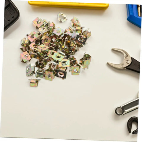 50 Pack Hella Tough U Shape Nut Fasteners For Automotive Body Clips Heavy Duty metal U-nuts on a flat surface with tools.